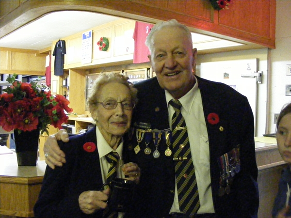 Comrades Kay McInnes and John Miller after the parade.