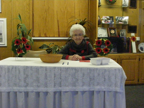 Betty already at her post waiting for everyone to head on in to the banquet supper.